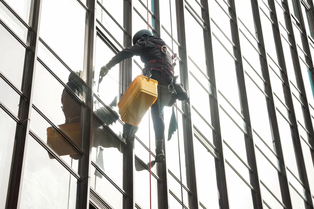 fdz_0002_industrial-mountaineer-worker-hangs-on-facade-skys-2023-05-18-05-58-24-utc